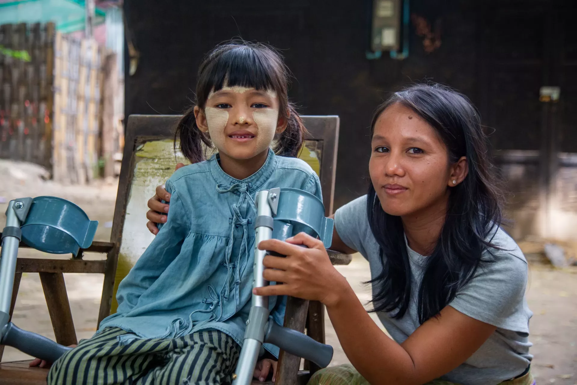 A child with an assistive device provided by UNICEF after the earthquake in Myanmar